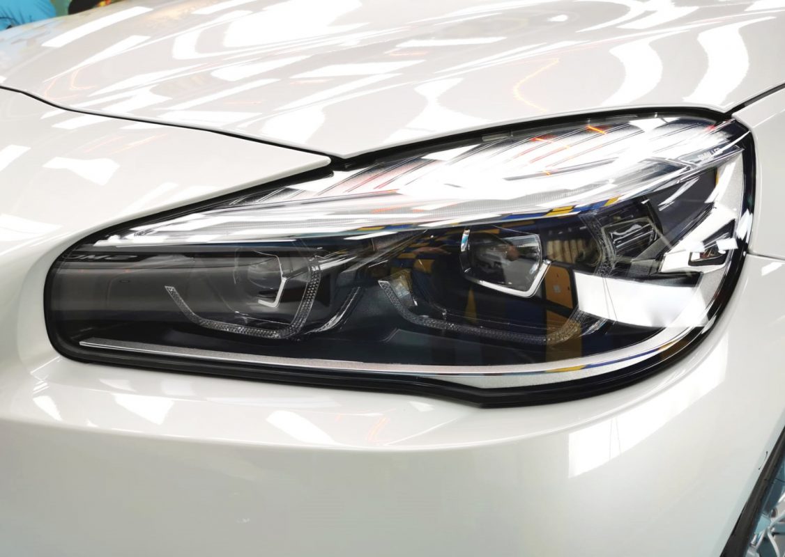 The BMW 420i parked in the workshop, freshly coated.