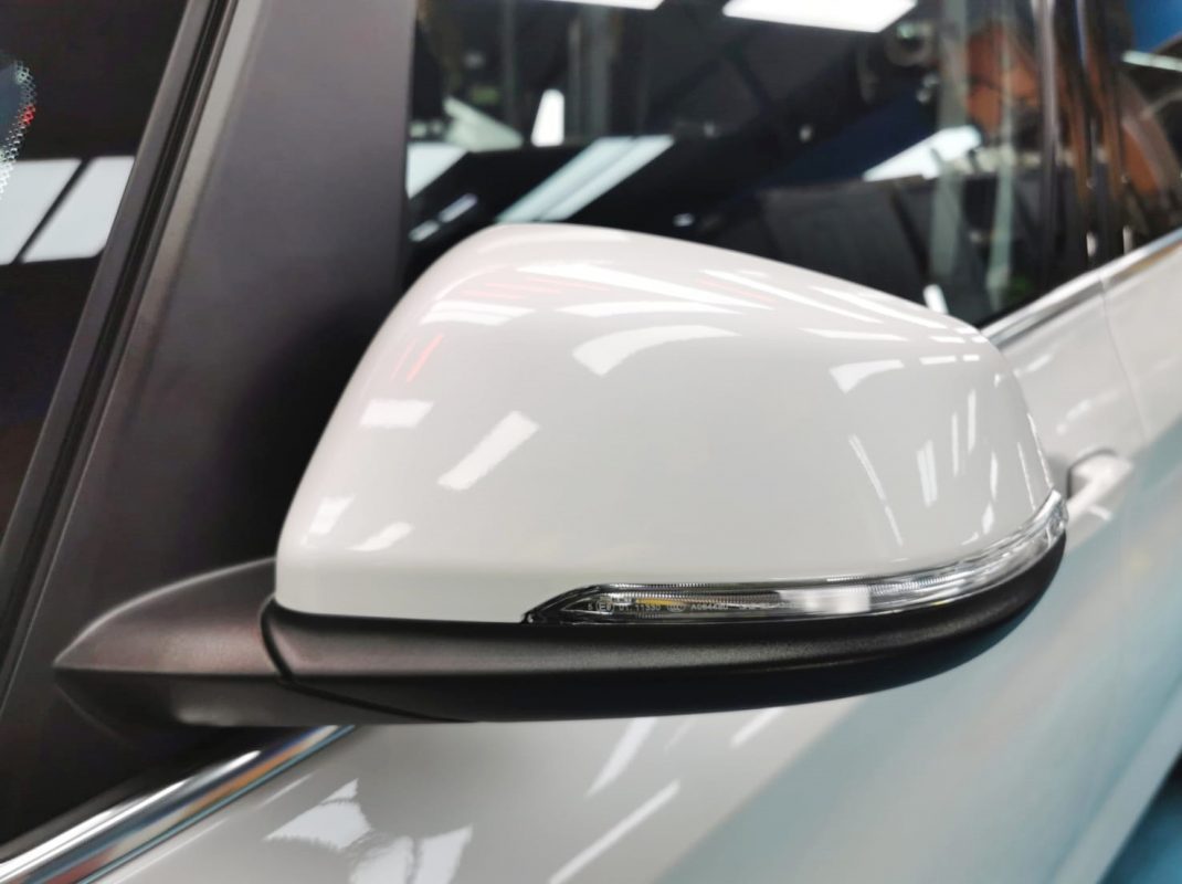 Rear quarter of the BMW 420i, glossy and protected.