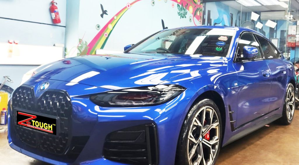 The 430i's coated paintwork showing clean reflections.
