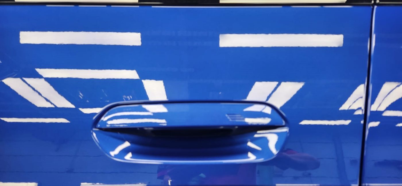 Rear quarter of the BMW 430i, glossy and protected.