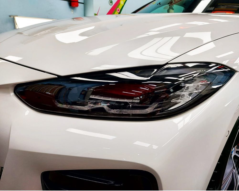 The 430i's coated paintwork holding clean reflections.