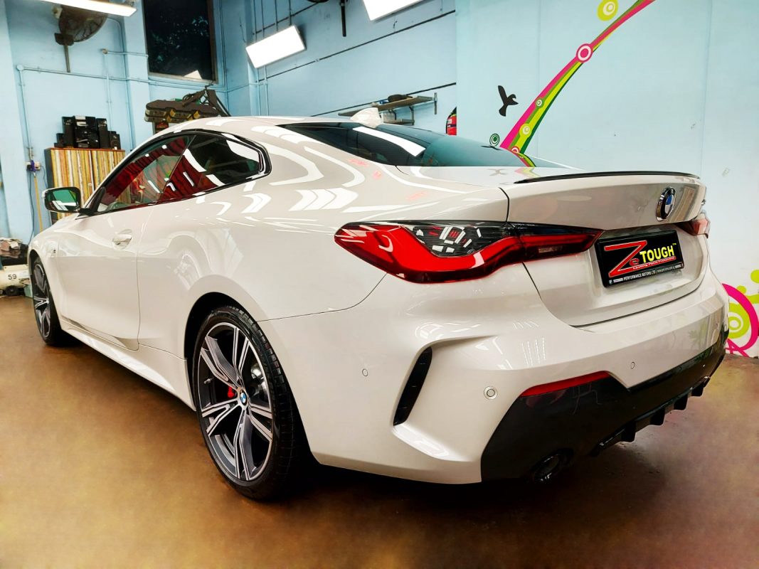 Rear quarter of the BMW 430i, glossy and protected.