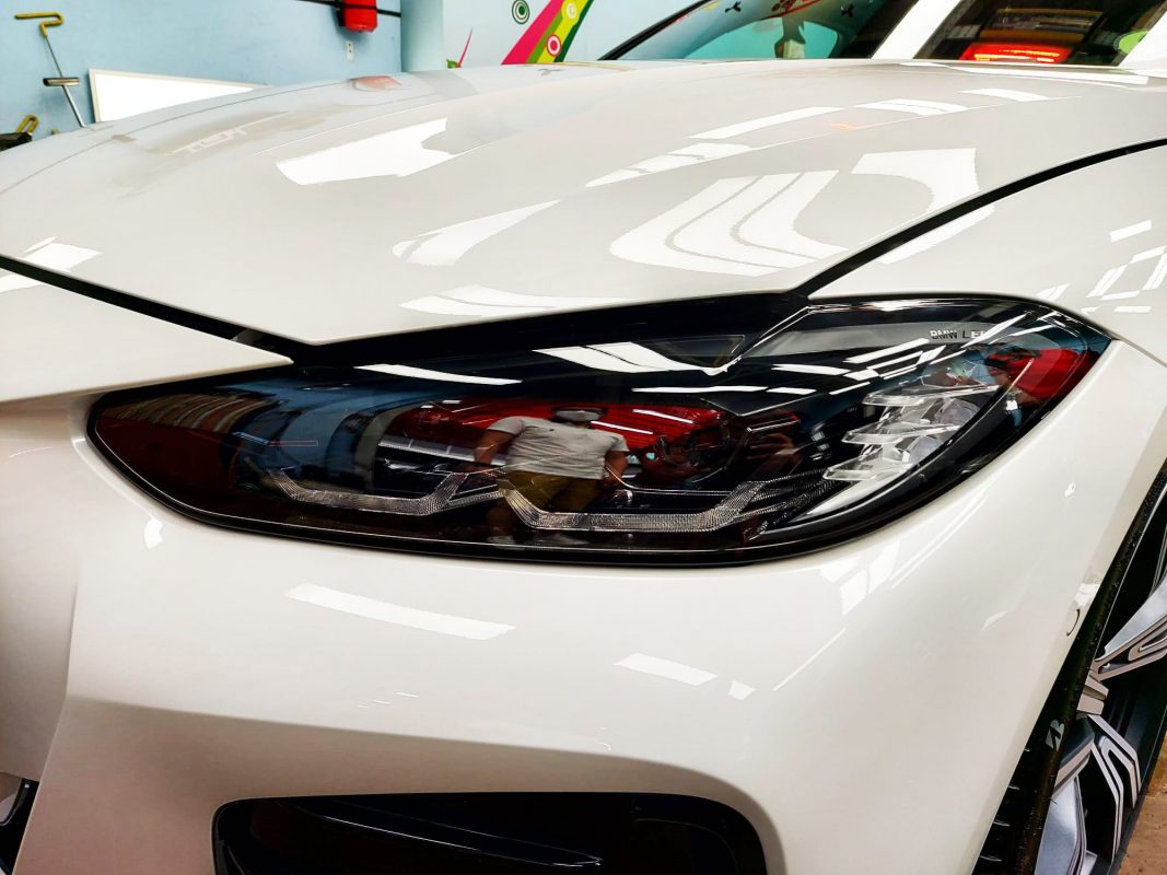 The 430i's coated paintwork holding clean reflections.
