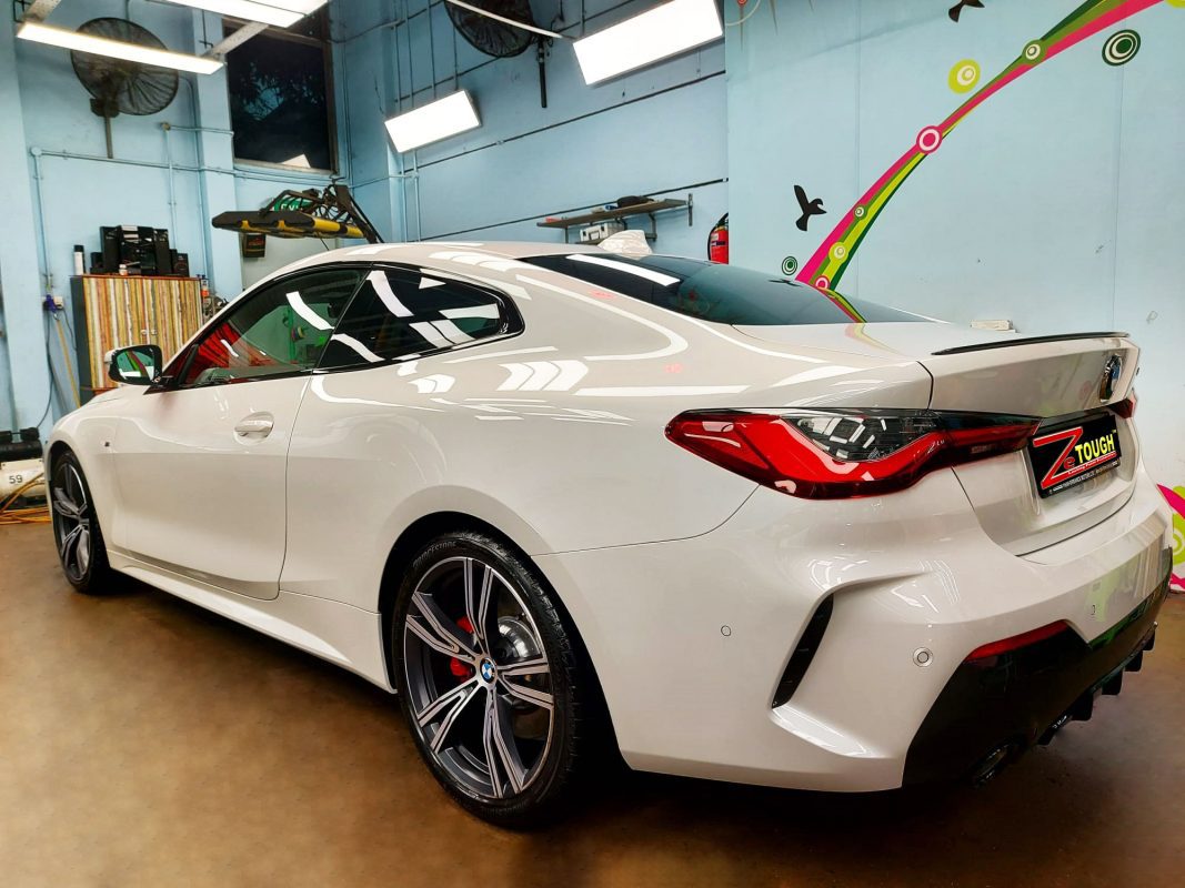 Rear quarter of the BMW 430i, glossy and protected.