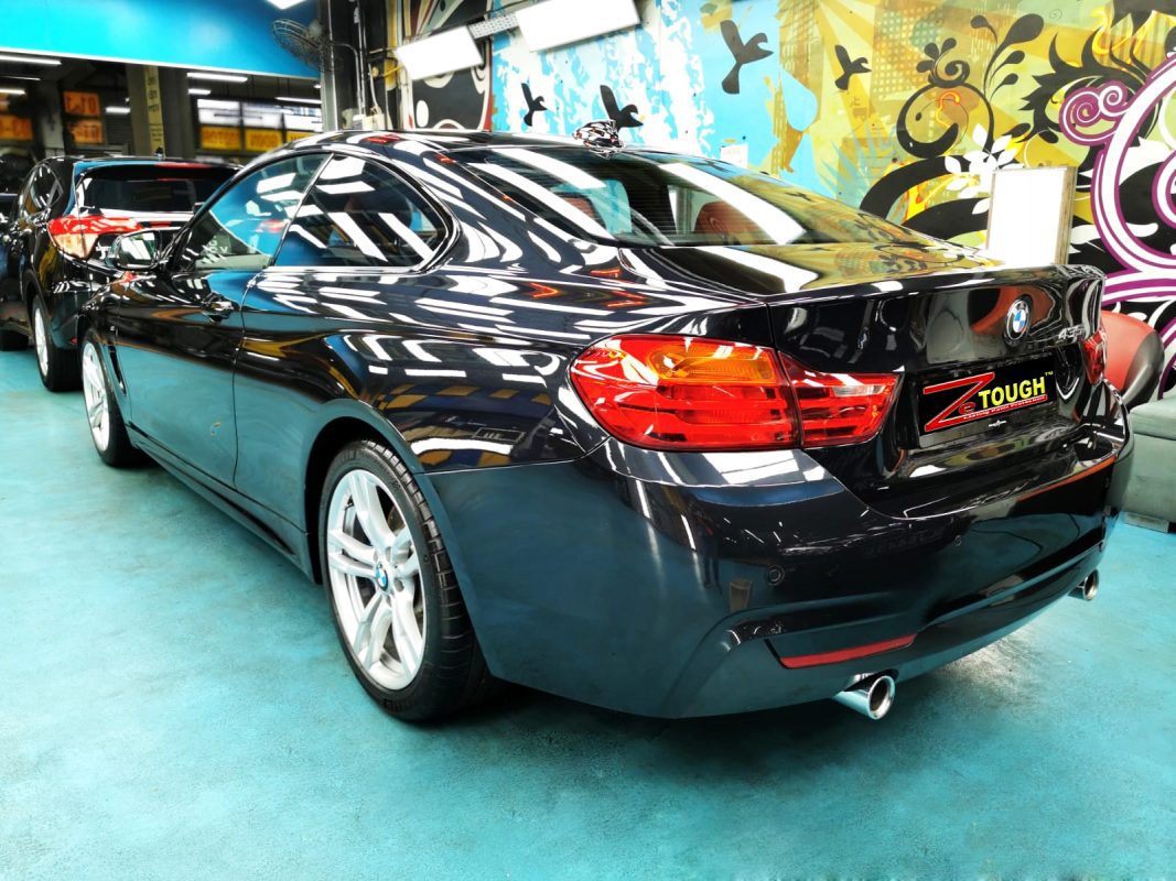 Rear quarter of the BMW 435i Coupe, glossy and protected.
