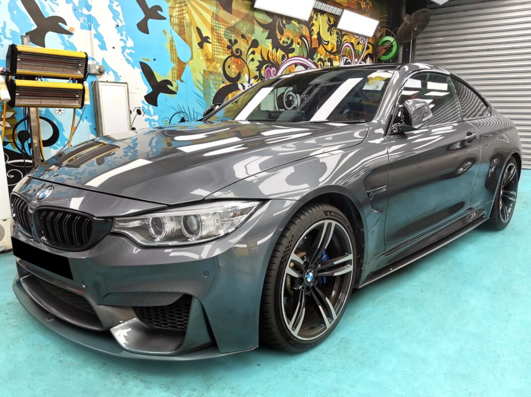 The BMW 435i as it arrived at Revol Carz, front view showing the faded and blemished paintwork.