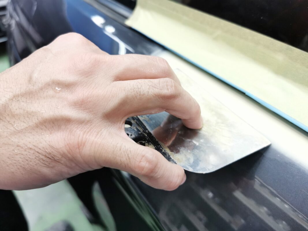 The BMW 435i surface being inspected on Day 3, checking for scratches and blemishes.