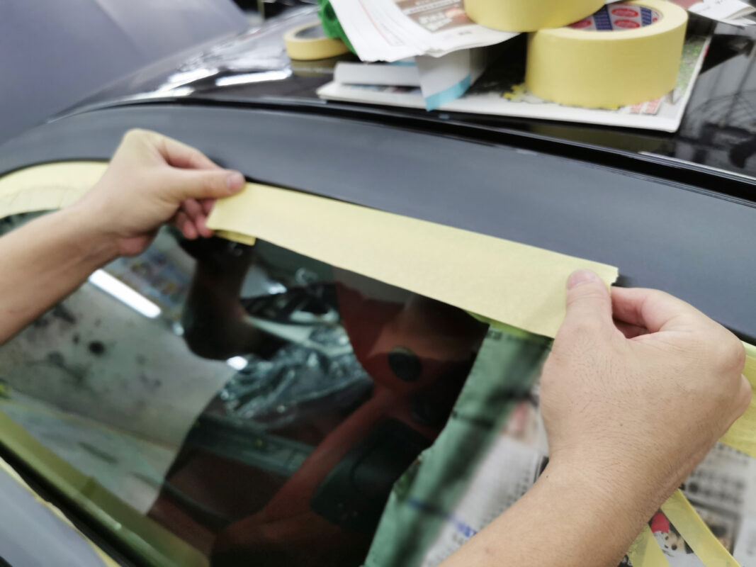 The BMW 435i masked on Day 5 to protect trim and glass from overspray.