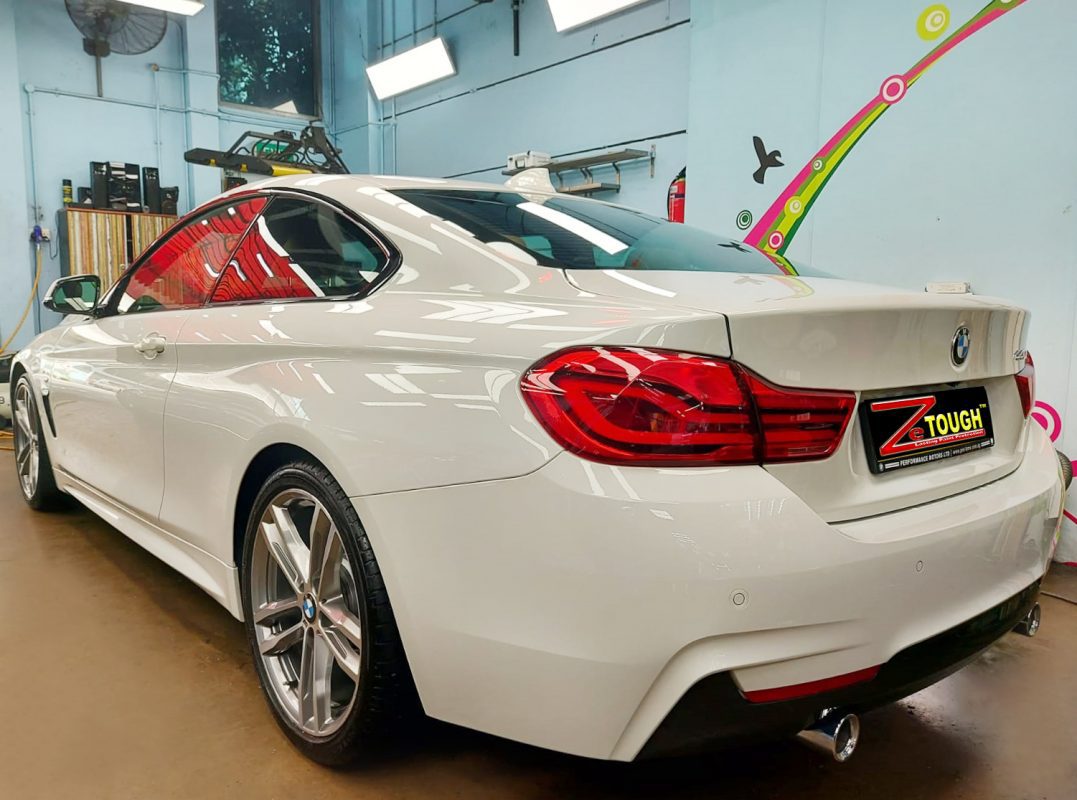 Rear quarter of the BMW 440i, glossy and protected.