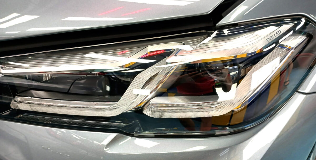 The 5 Series' coated paintwork showing clean reflections.