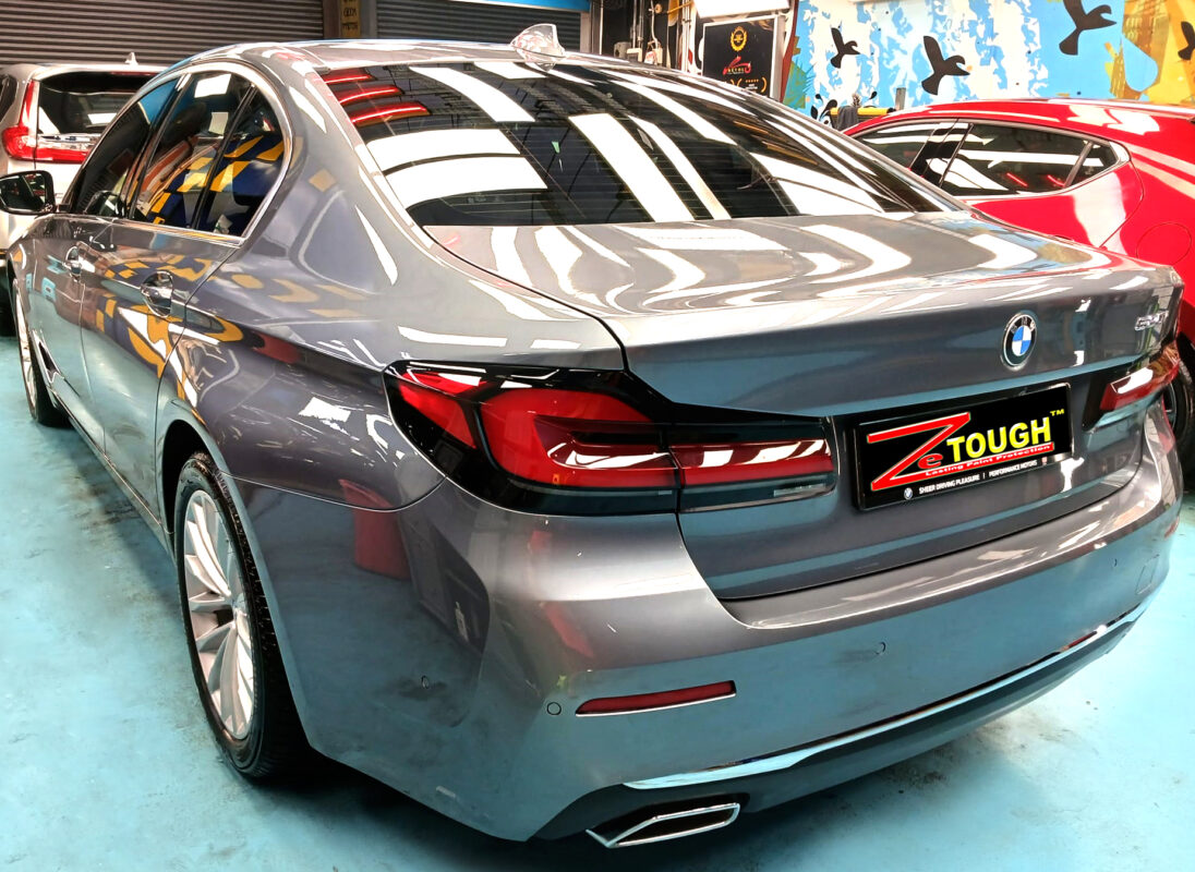 Rear quarter of the BMW 5 Series, glossy and protected.