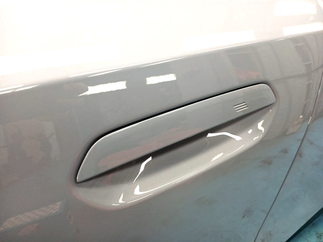 Rear quarter of the BMW 5 Series, glossy and protected.