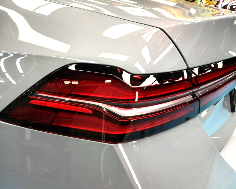 The BMW 5 Series parked in the workshop, freshly coated.