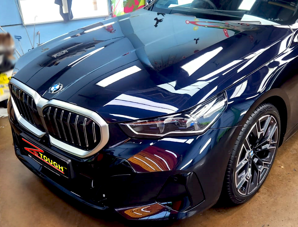 The BMW 5 Series from a side angle after the ceramic coating.