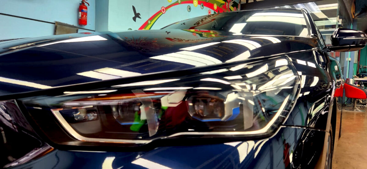 The 5 Series' coated paintwork showing clean reflections.