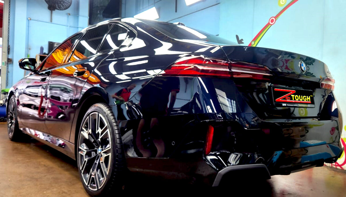Rear quarter of the BMW 5 Series, glossy and protected.