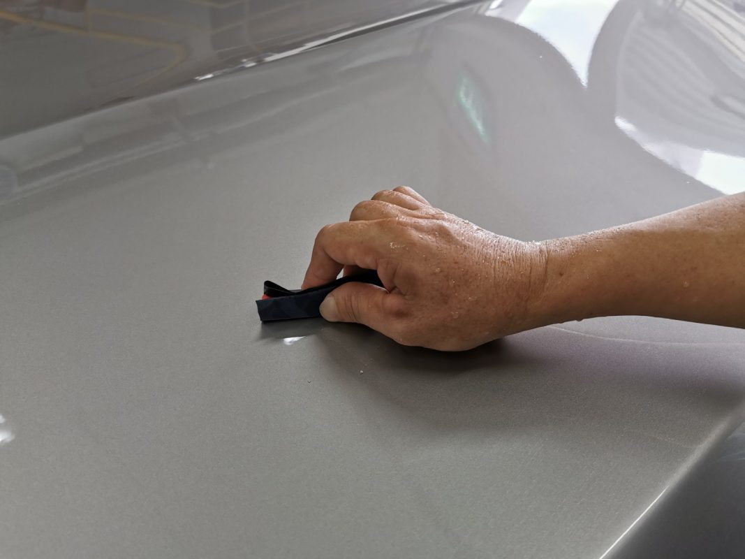 The 5 Series after spraying, being wet-sanded again for an even surface.