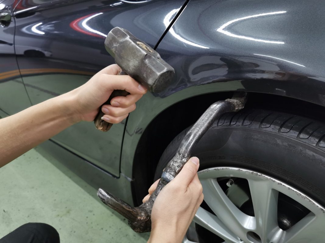 Repairing the dent and scratches and patching the body.