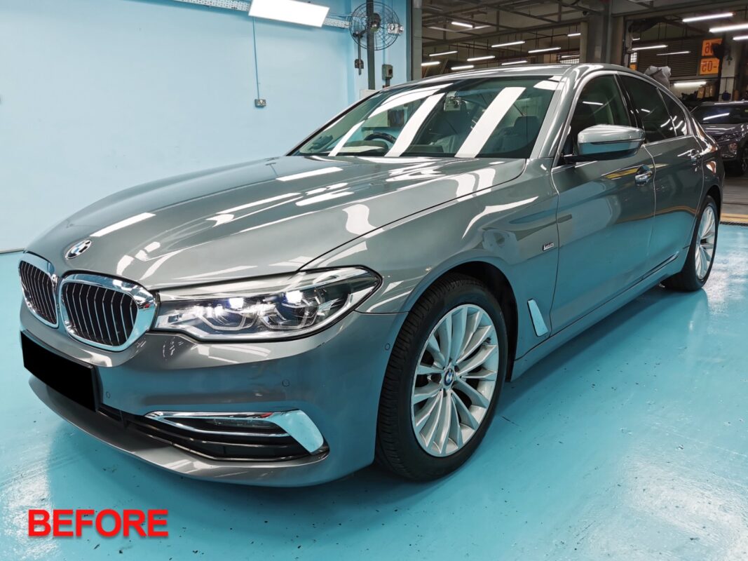 The BMW 5 Series after full respray, first finished look in the workshop.