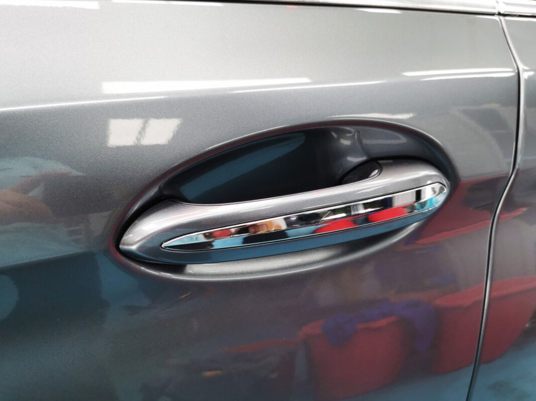 Before: the BMW 5 Series at the start, with deep scratches and paint peel-off.