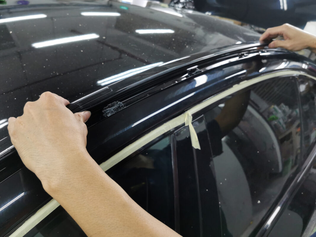 Compound polishing the BMW 5 Series to bring up a mirror-shine.