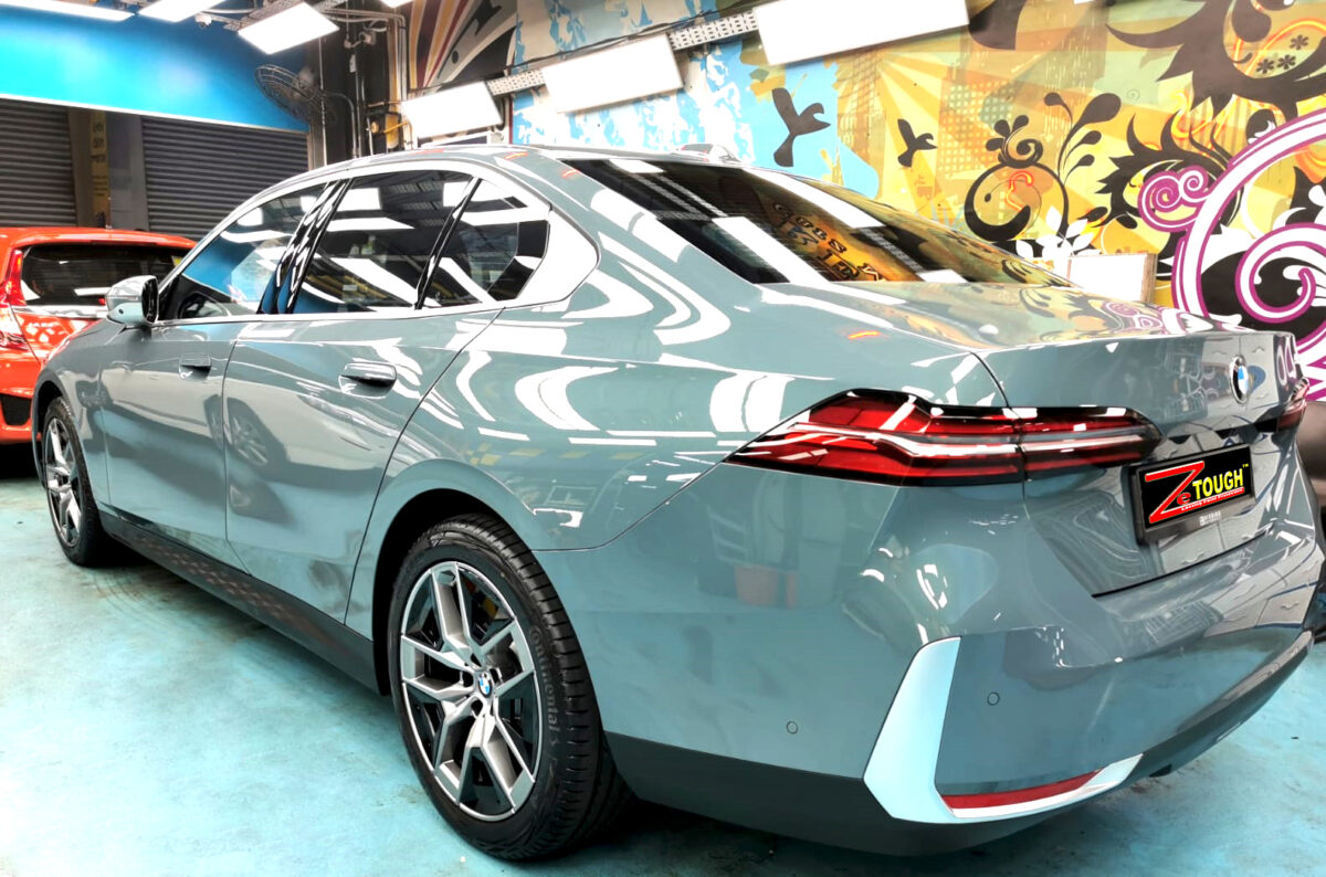 Rear quarter of the BMW 5 Series, glossy and protected.