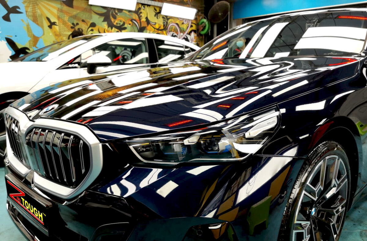 The BMW 5 Series from a side angle after the ceramic coating.