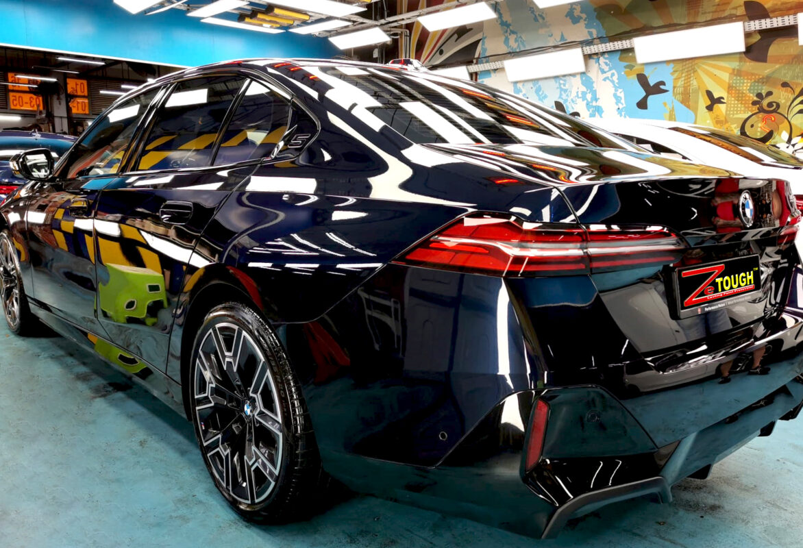Rear quarter of the BMW 5 Series, glossy and protected.