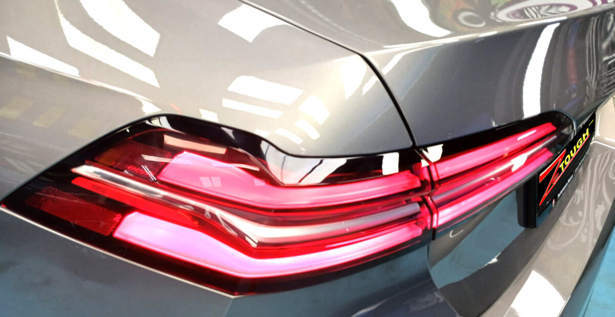 Rear quarter of the BMW 5 Series, glossy and protected.