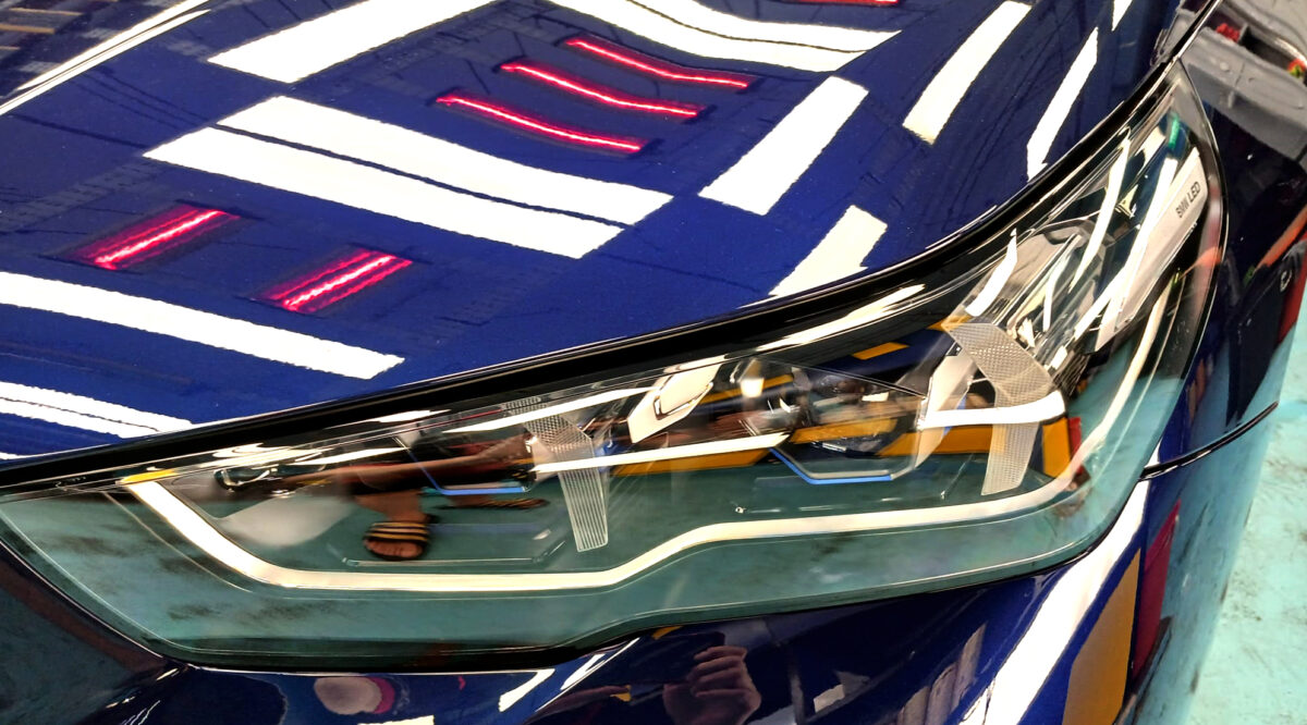 The 5 Series' coated paintwork showing clean reflections.