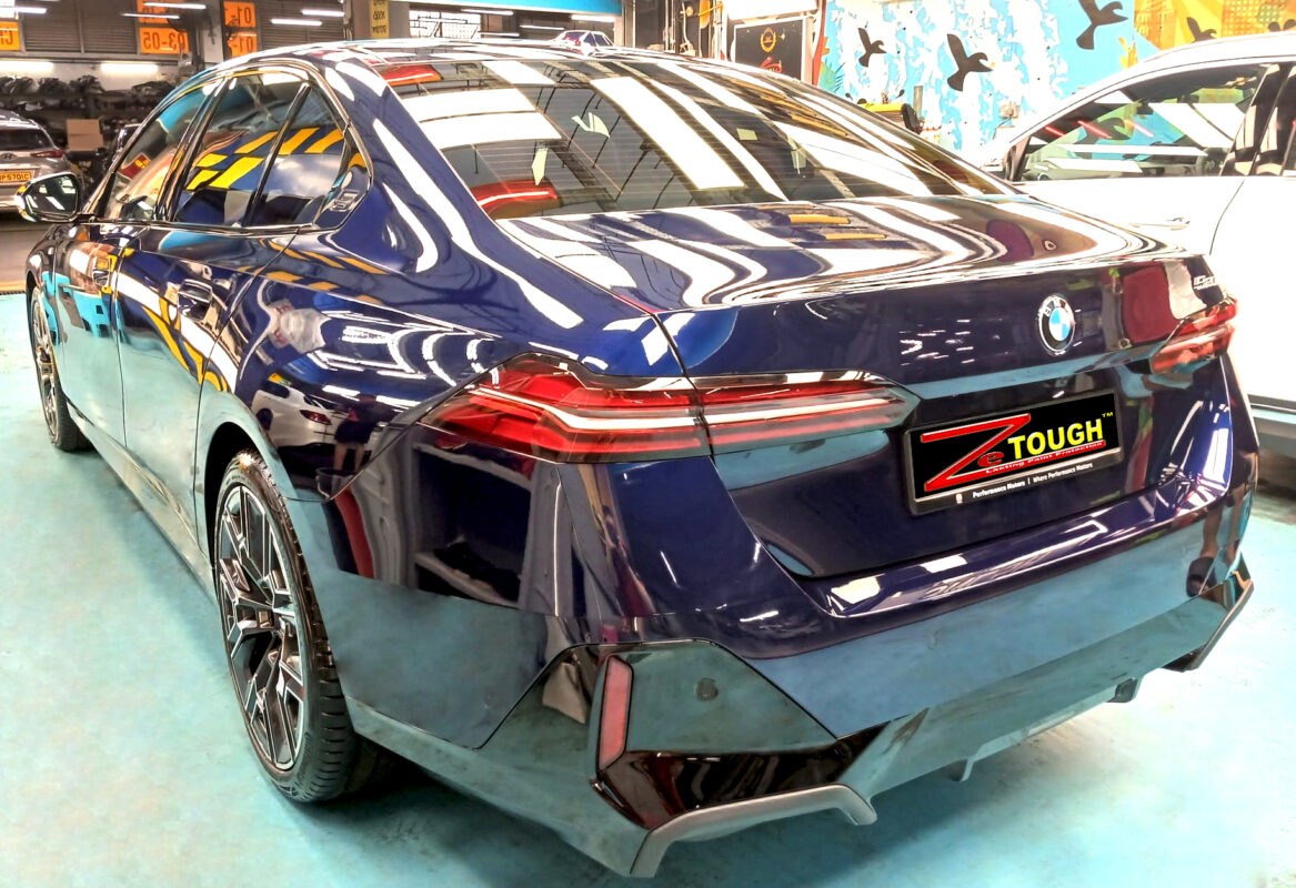 Rear quarter of the BMW 5 Series, glossy and protected.