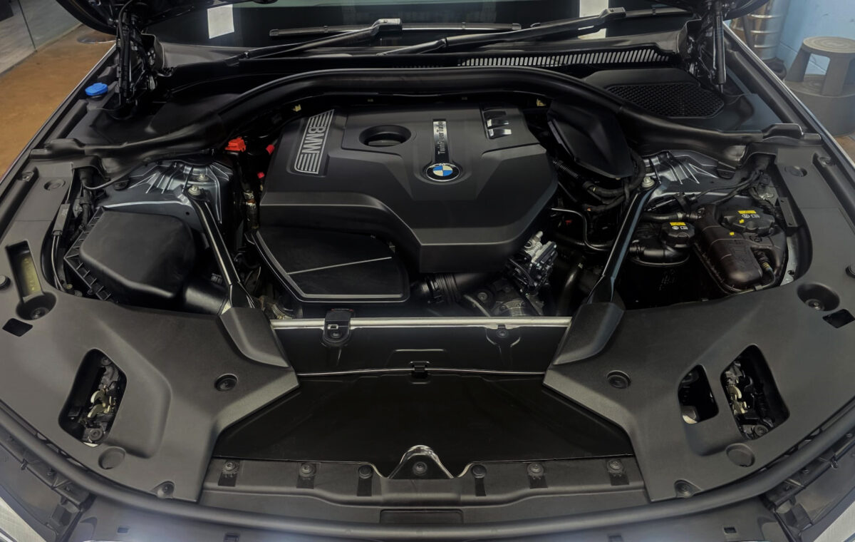 Reflections across the coated panels of the BMW 5 Series.