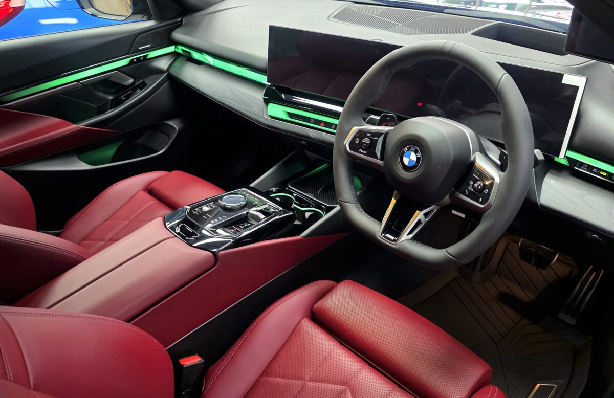 Reflections across the coated panels of the BMW 5 Series.