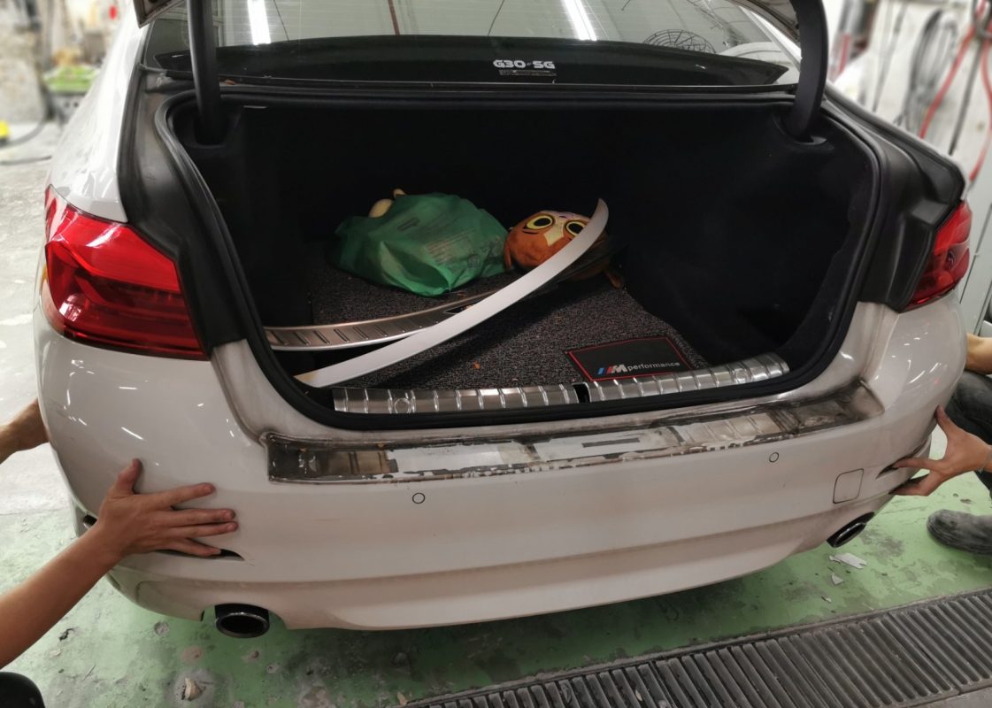 Removed parts set aside as the 520D is prepared for the respray.