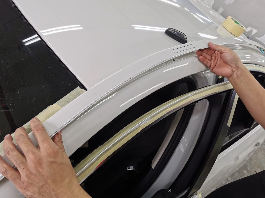 Polishing the new paint on the 520D to bring up the shine.