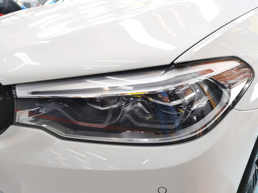 The 520d's coated paintwork showing clean reflections.