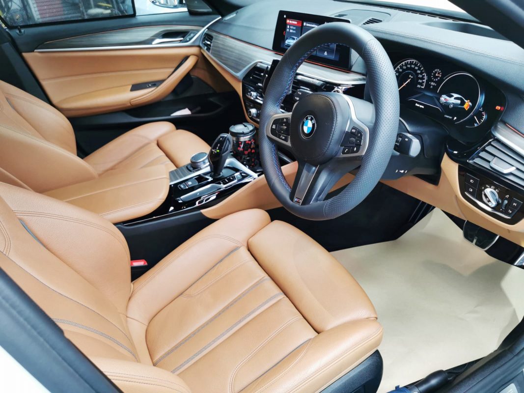 The BMW 520d parked in the workshop, freshly coated.
