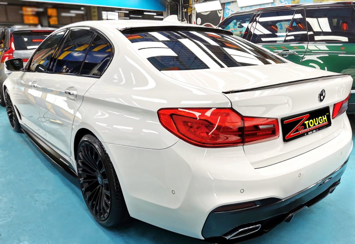 Rear quarter of the BMW 520d, glossy and protected.