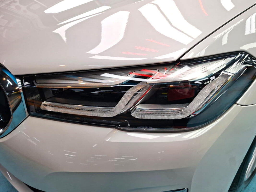 The BMW 520i's coated paintwork showing clean reflections.
