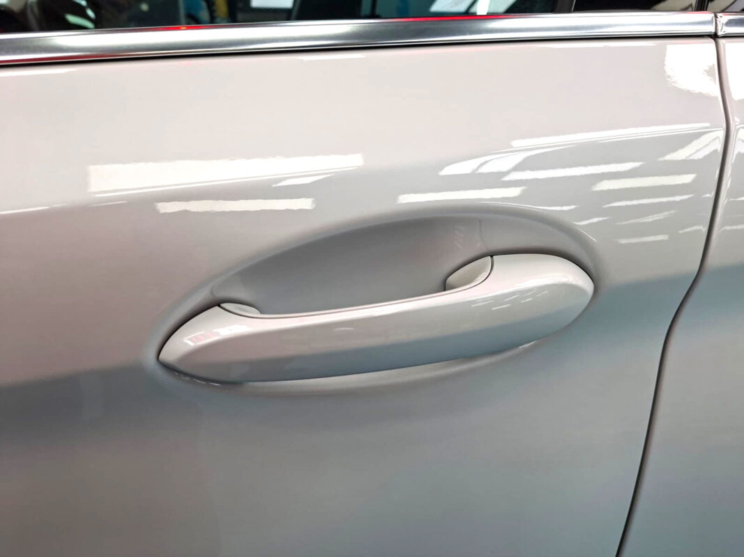 Front three-quarter view of the BMW 520i after coating.
