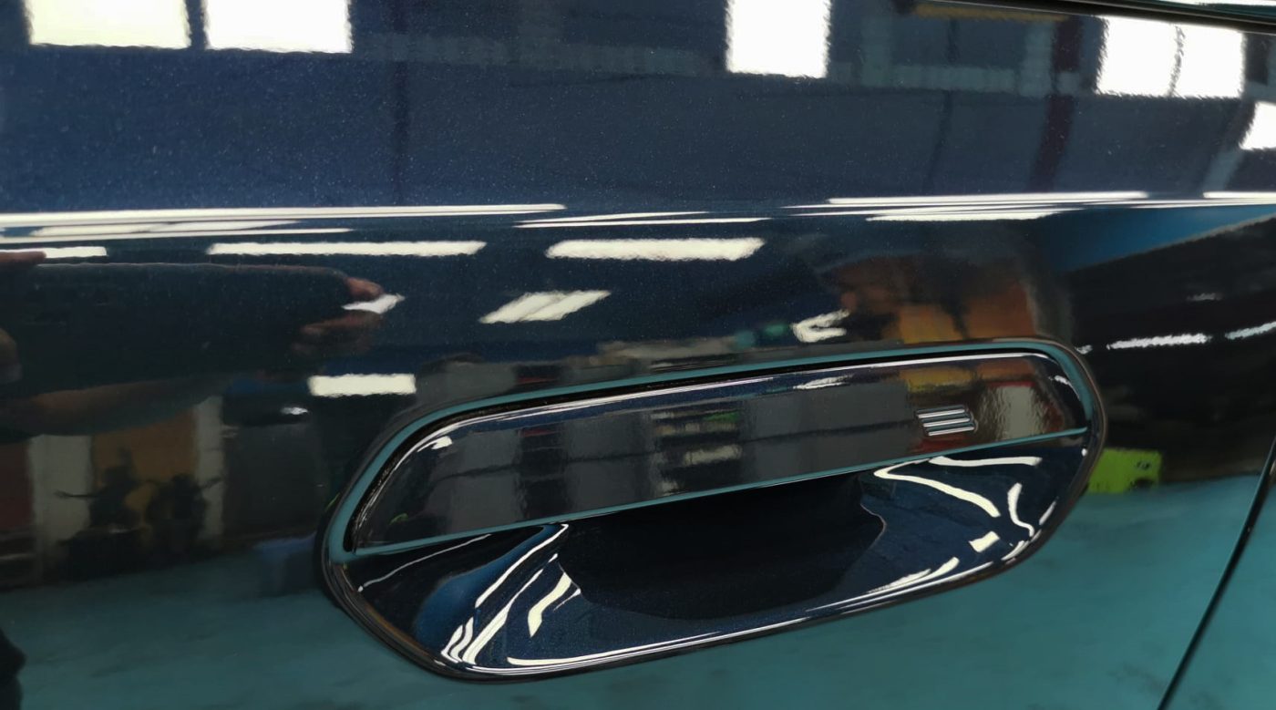 Front three-quarter view of the BMW 520i after coating.