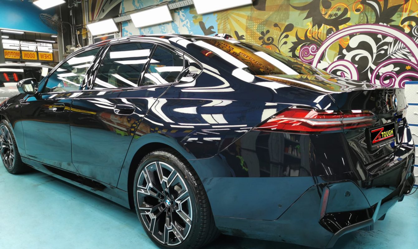 Rear quarter of the BMW 520i, glossy and protected.