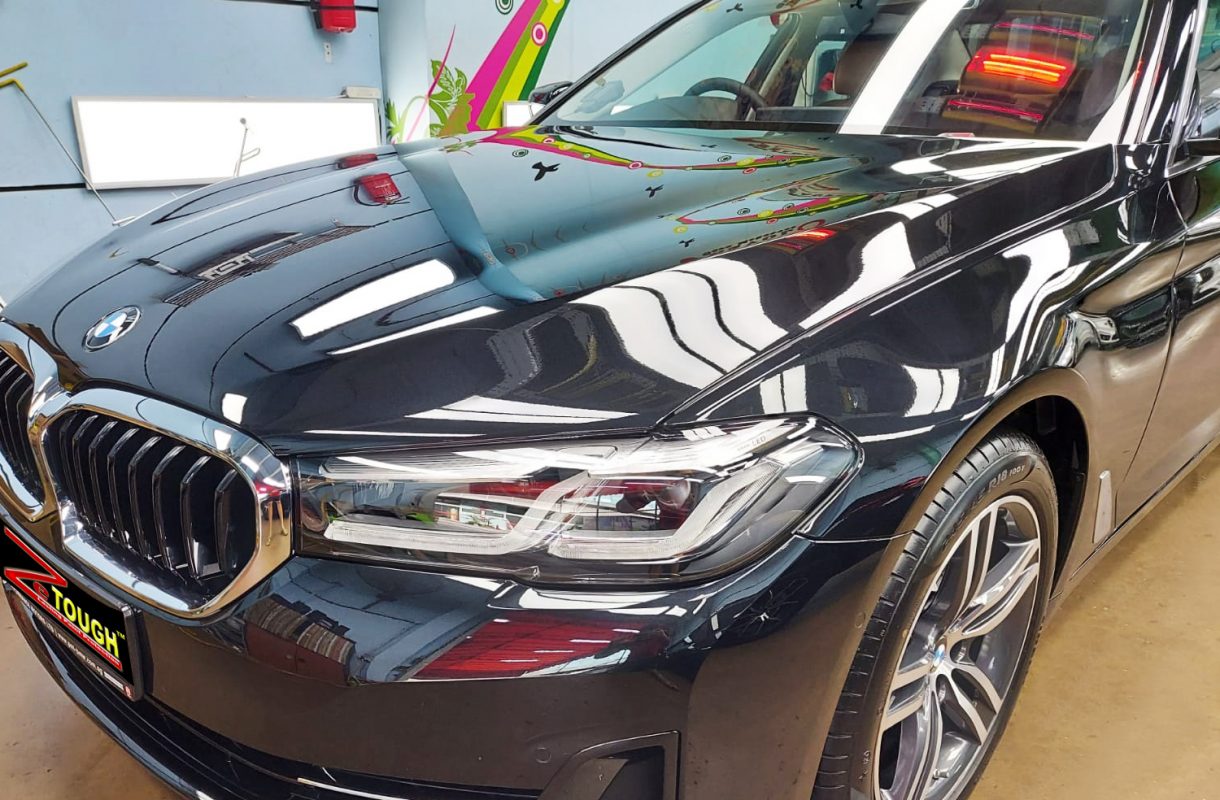 The BMW 520i from a side angle after the titanium coating.