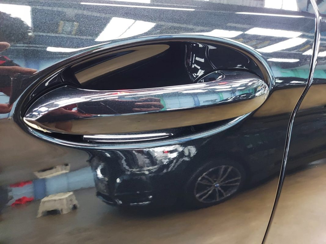 Front three-quarter view of the BMW 520i after coating.