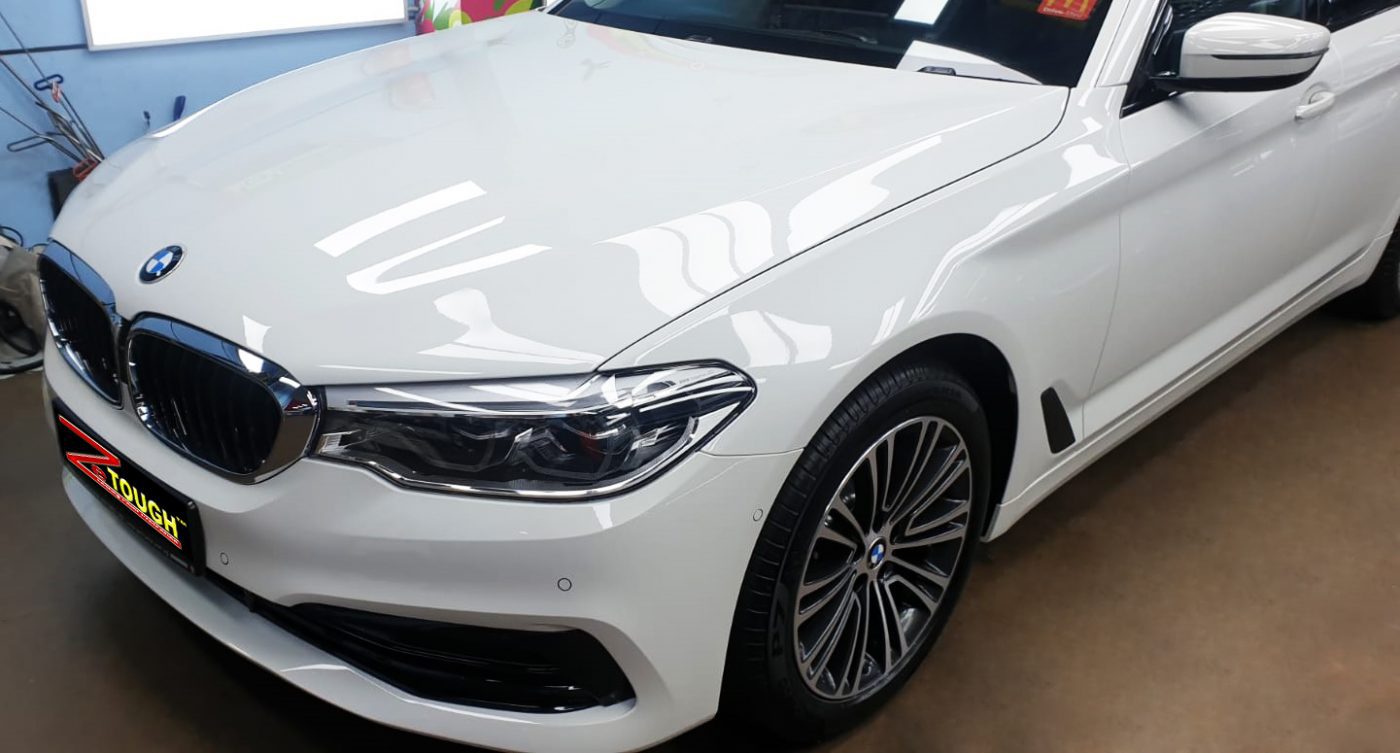 The BMW 520i from a side angle after the ceramic coating.