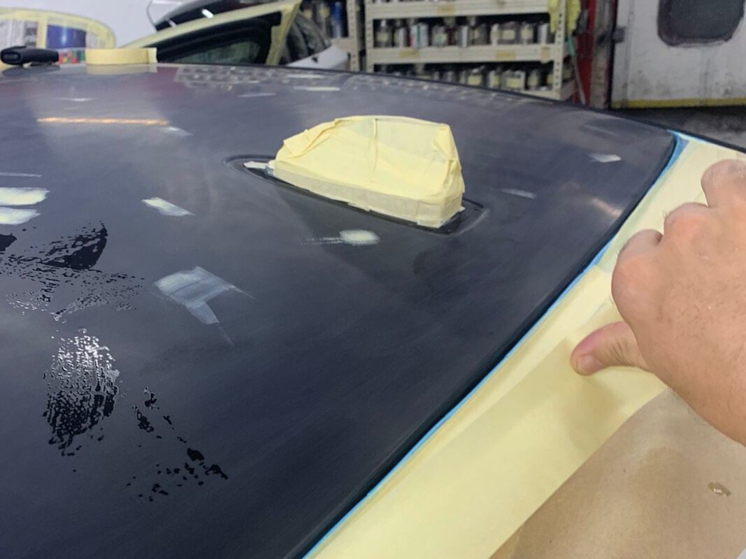 The BMW 520i masked up before entering the spray booth on Day 5.