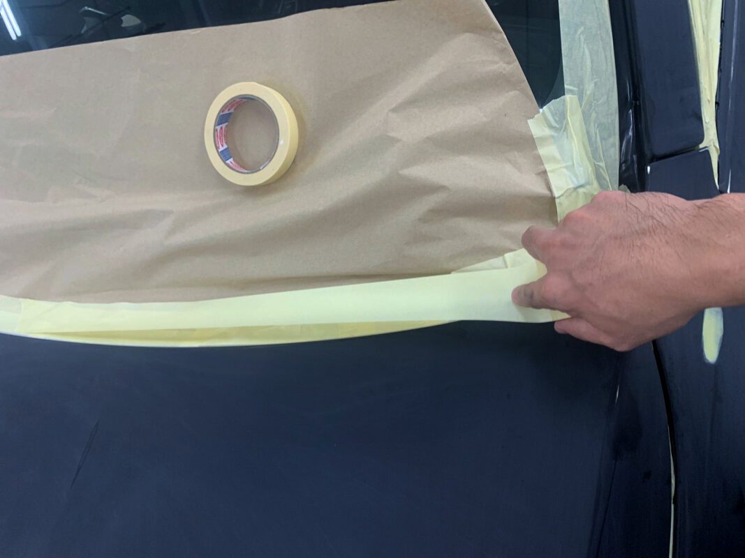 New colour coat going on the BMW 520i in the spray booth.