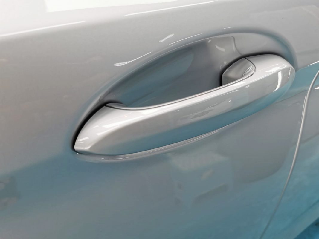 Front three-quarter view of the BMW 520i after coating.
