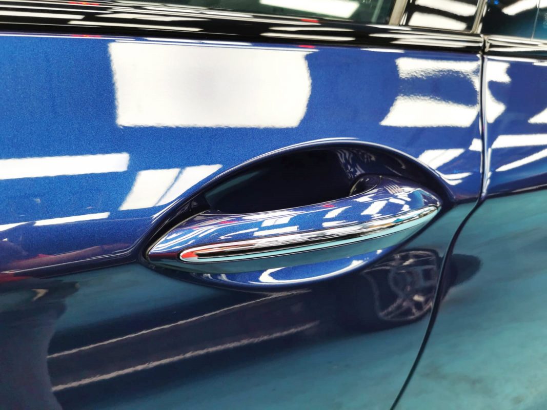 Front three-quarter view of the BMW 520i after coating.