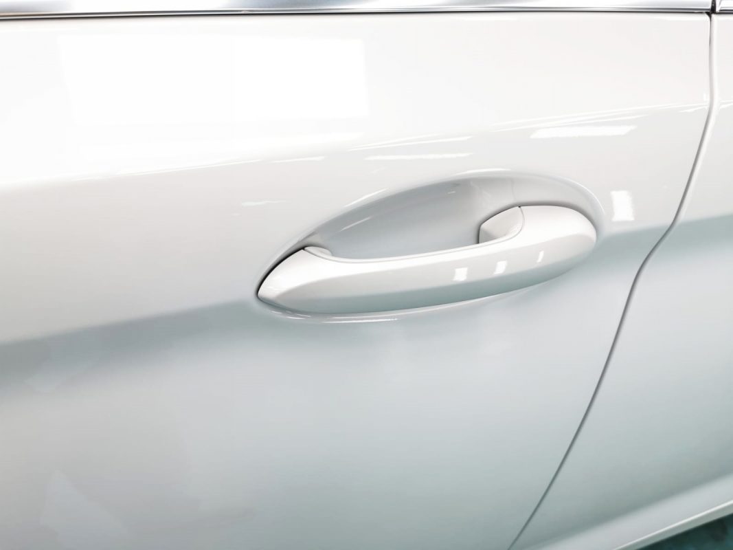 Front three-quarter view of the BMW 520i after coating.